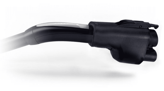 Black electric vehicle charging cable and connector against a plain background.